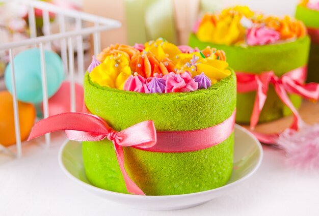 green-cakes-with-butter-cream-flowers-eggs_79919-2089