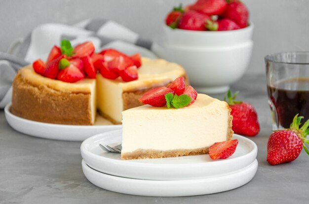 homemade-cheesecake-with-fresh-strawberries-white-plate_114420-853